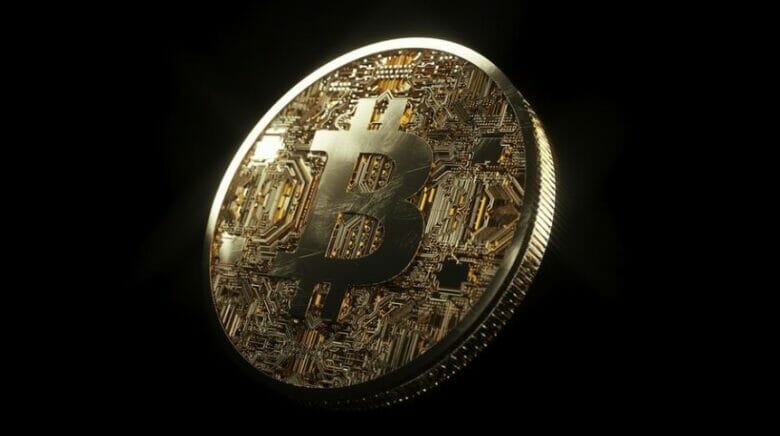 黒の背景に浮かぶビットコインイメージ画像